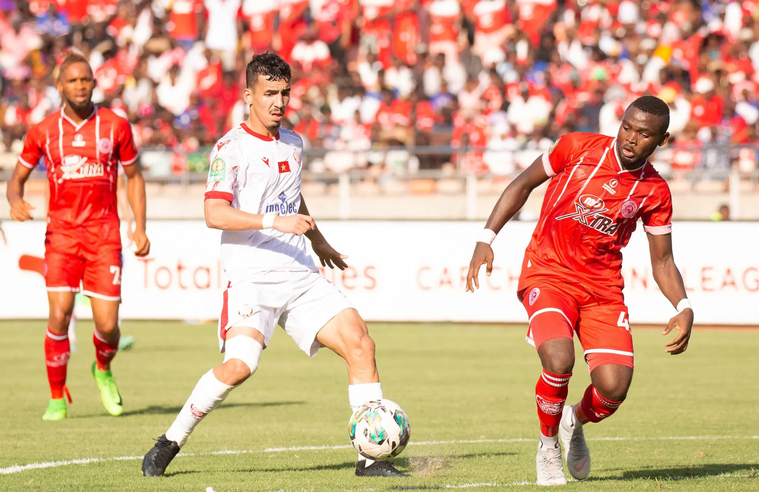 anas serrhat of wydad ac challenged by jean othos of simba sc during the caf champions league 2023 24 match between simba sc v wydad ac scaled